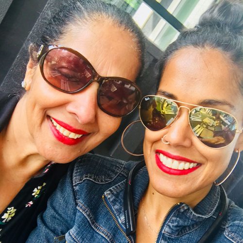 Ritu Bhasin and her mother both wearing sunglasses and smiling.